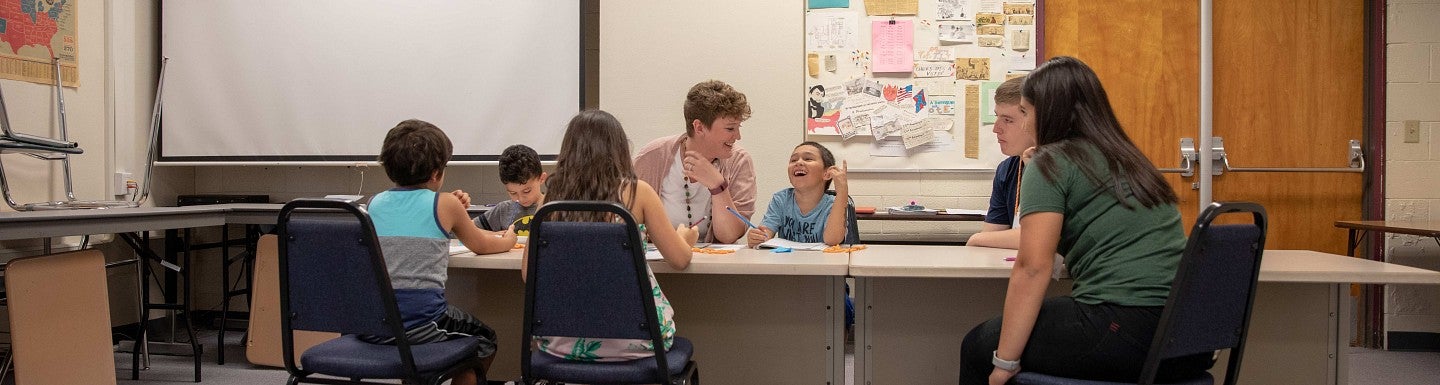 Special ed teacher working with students