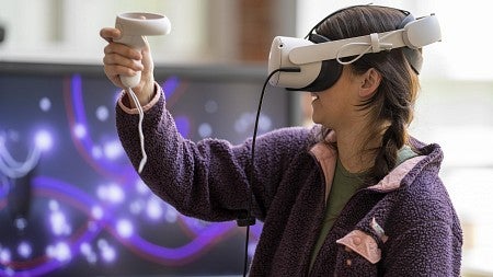 student using vr headset during immersive media day