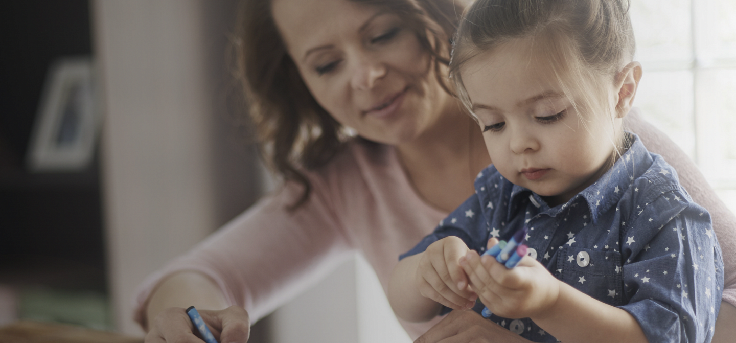mother and kid with crayons